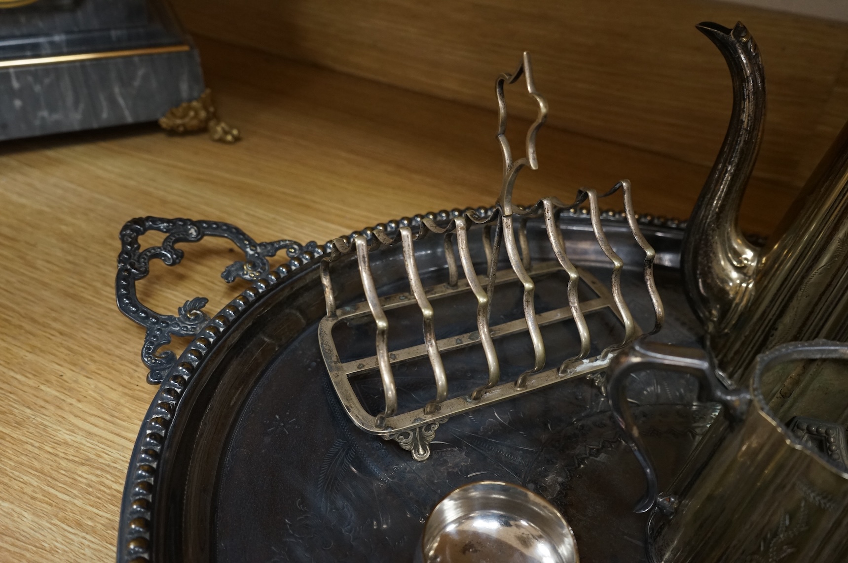 A collection of Victorian plated wares to include a pair of Corinthian column candelabra, 54cm
